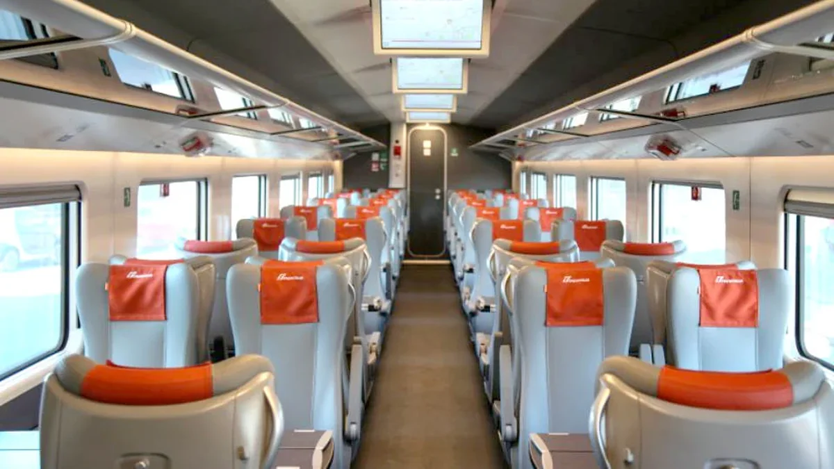Frecciarossa Standard class interior with 2 plus 2 seating and orange headrest covers
